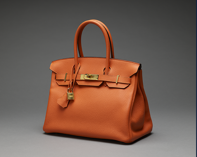 An orange Birkin handbag