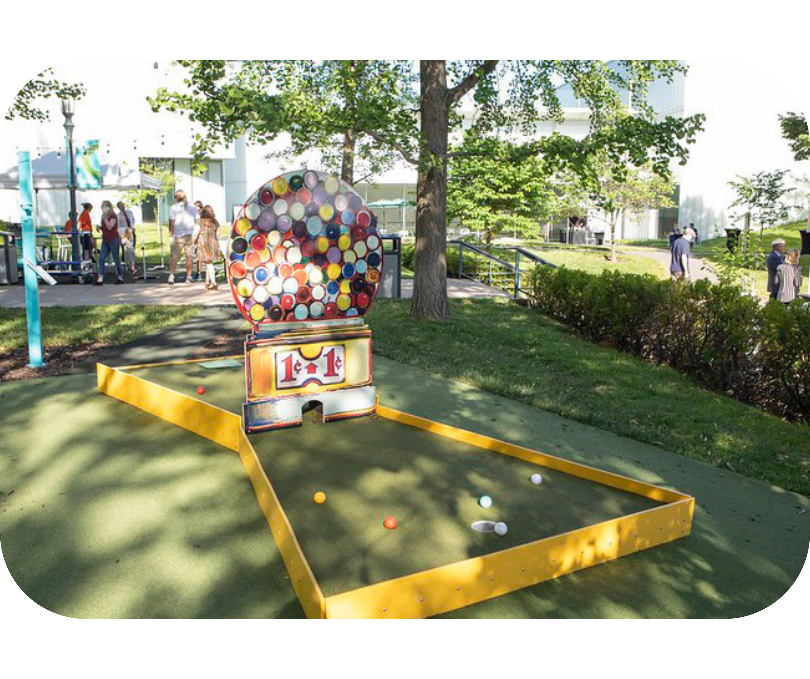 A mini-golf hole on the Nelson-Atkins Art Course inspired by Wayne Thiebaud's Jawbreaker Machine painting.
