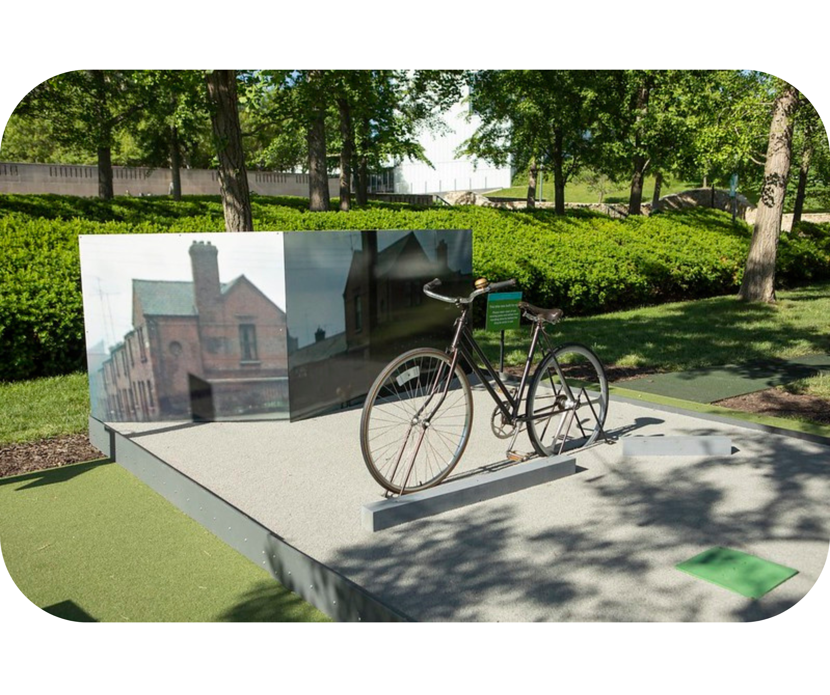 A mini-golf hole on the Nelson-Atkins Art Course inspired by Evelyn Hofer's photograoh Girl With Bicycle in the Coombe, Dublin.