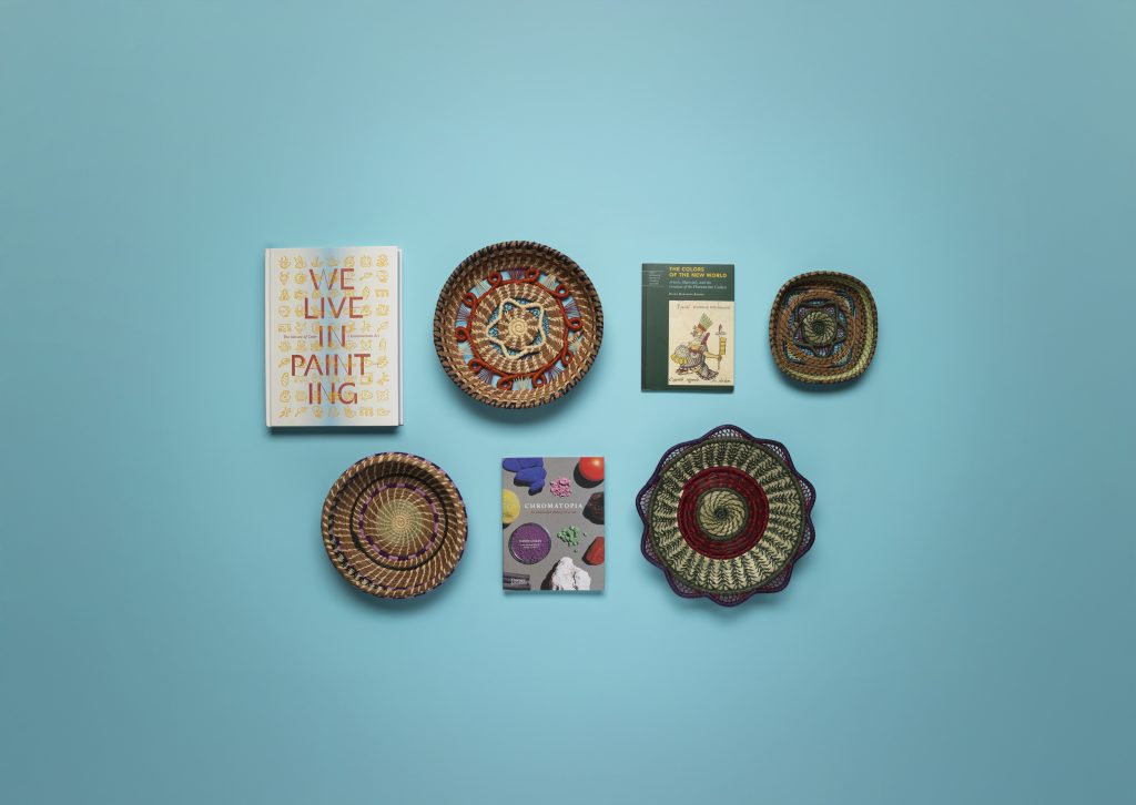Image of items from museum store collection including books, bowls, plates.