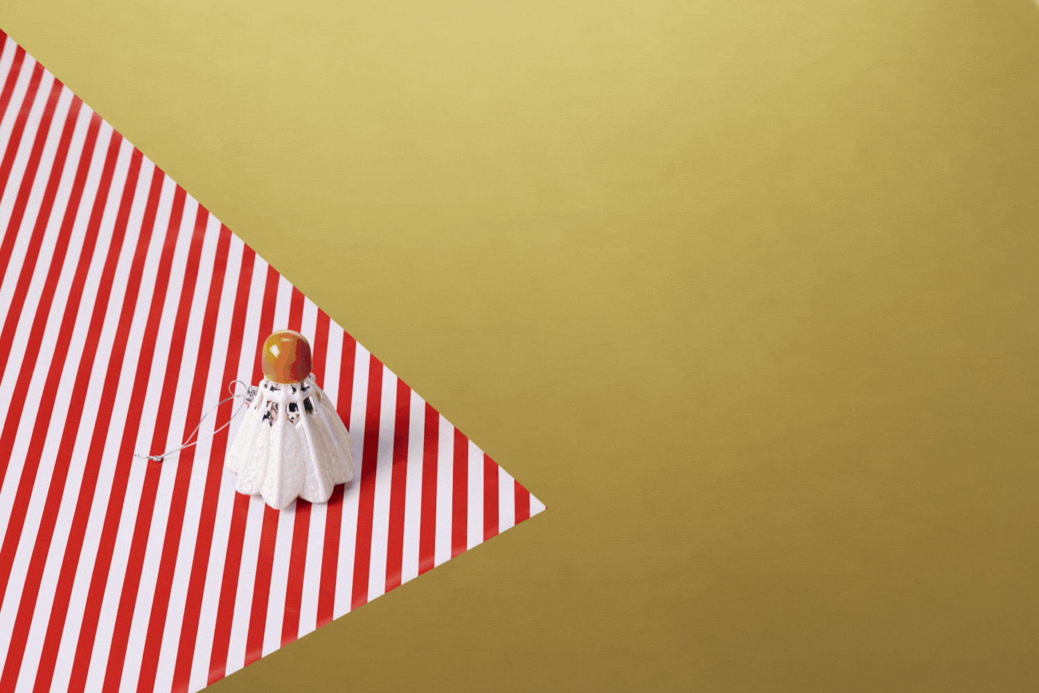 Rotating gif image of holiday items at the museum store including sketch book, art kit, shuttlecock ornament, rabbit toy, and vase.