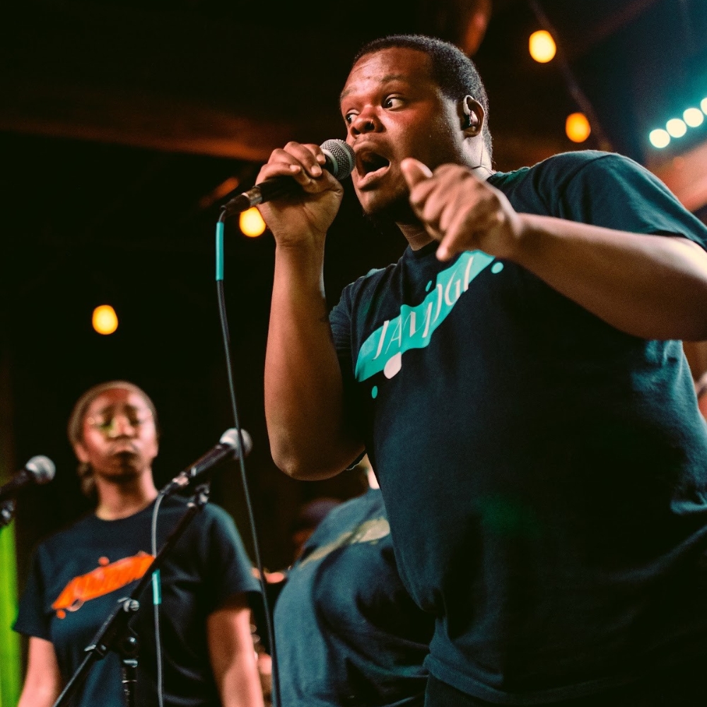 The eponymous frontperson of Jamogi & the Jammers performs onstage