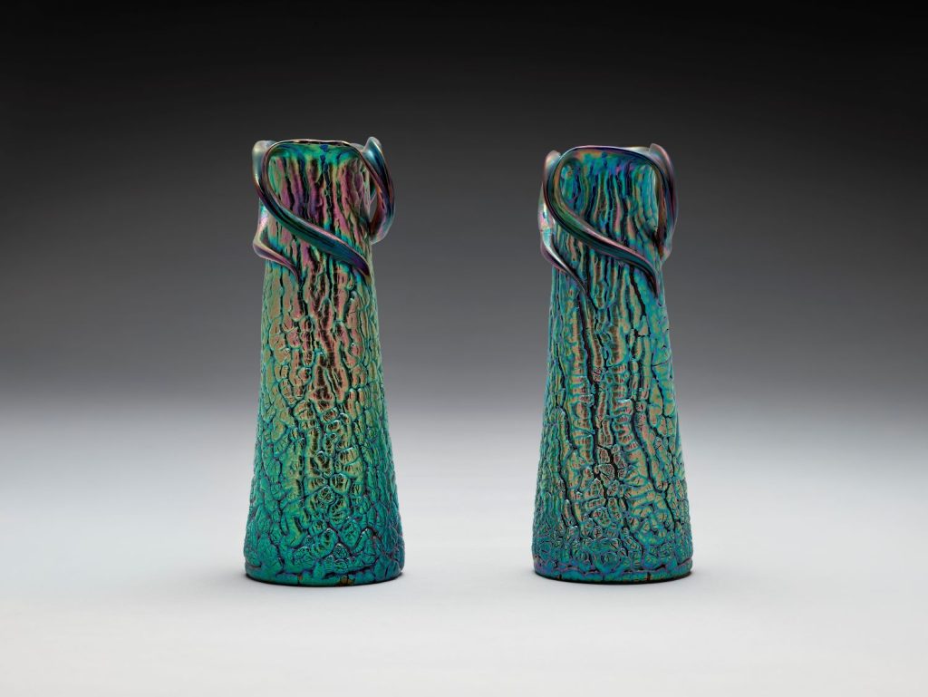 A pair of vases in green pearlescent colors.