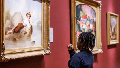 Colored pencils layed out over a drawing on paper.