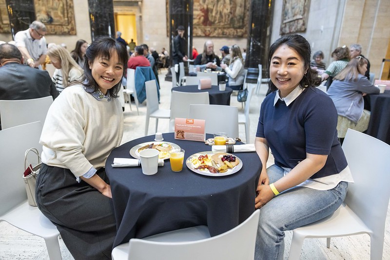 Two members enjoying pancake breakfast in kirkwood hall