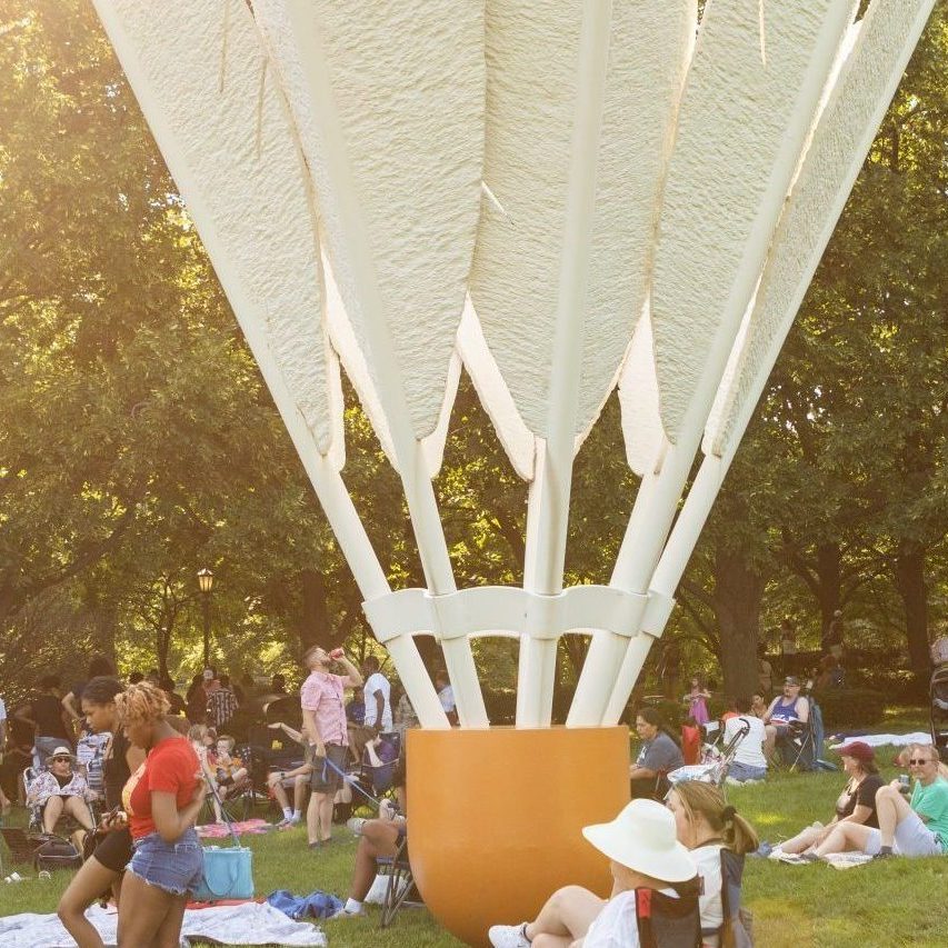 Guests gather on the south lawn of the Nelson-Atkins near Shuttlecock #3.