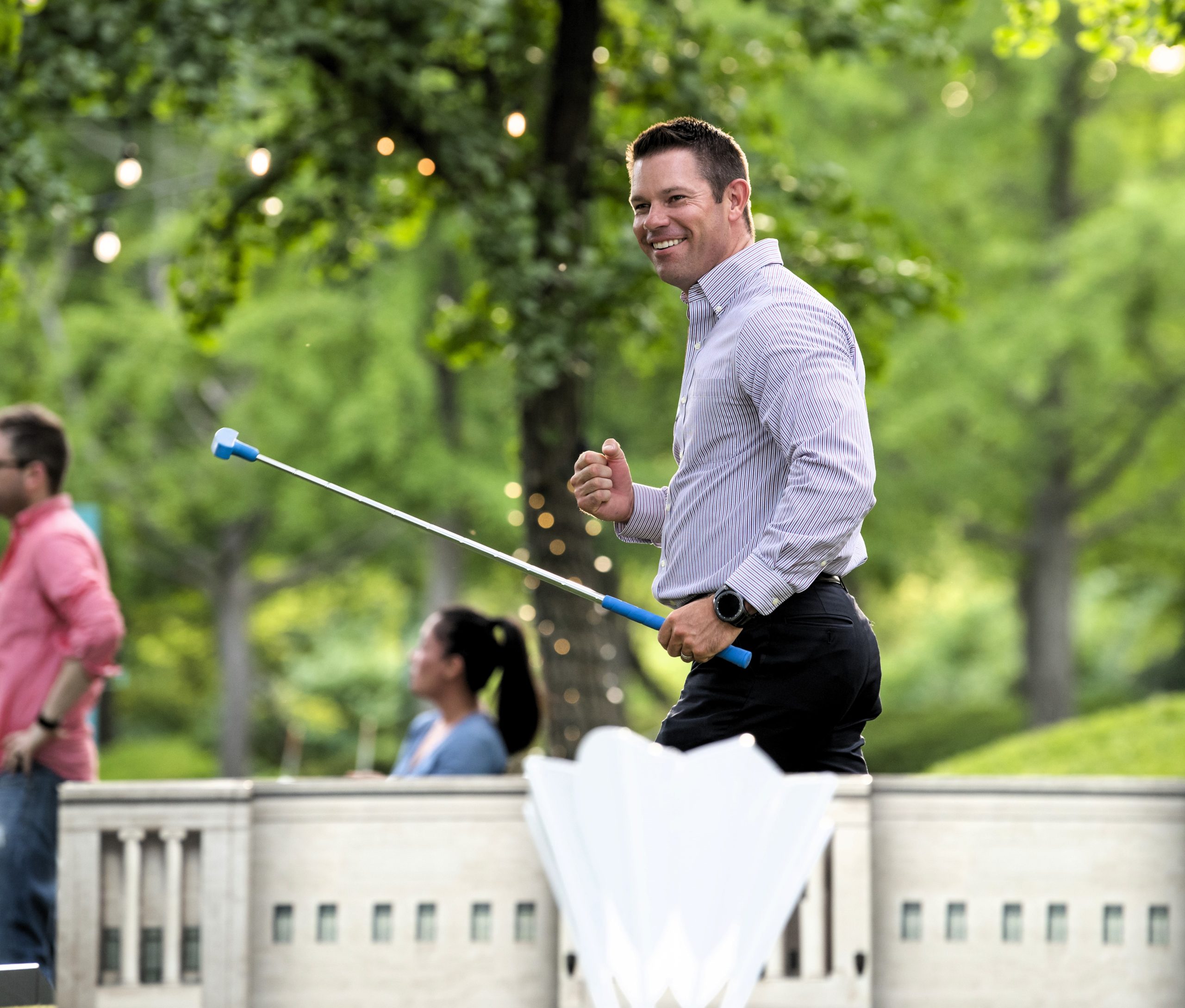 A guest celebrates a mini golf putt