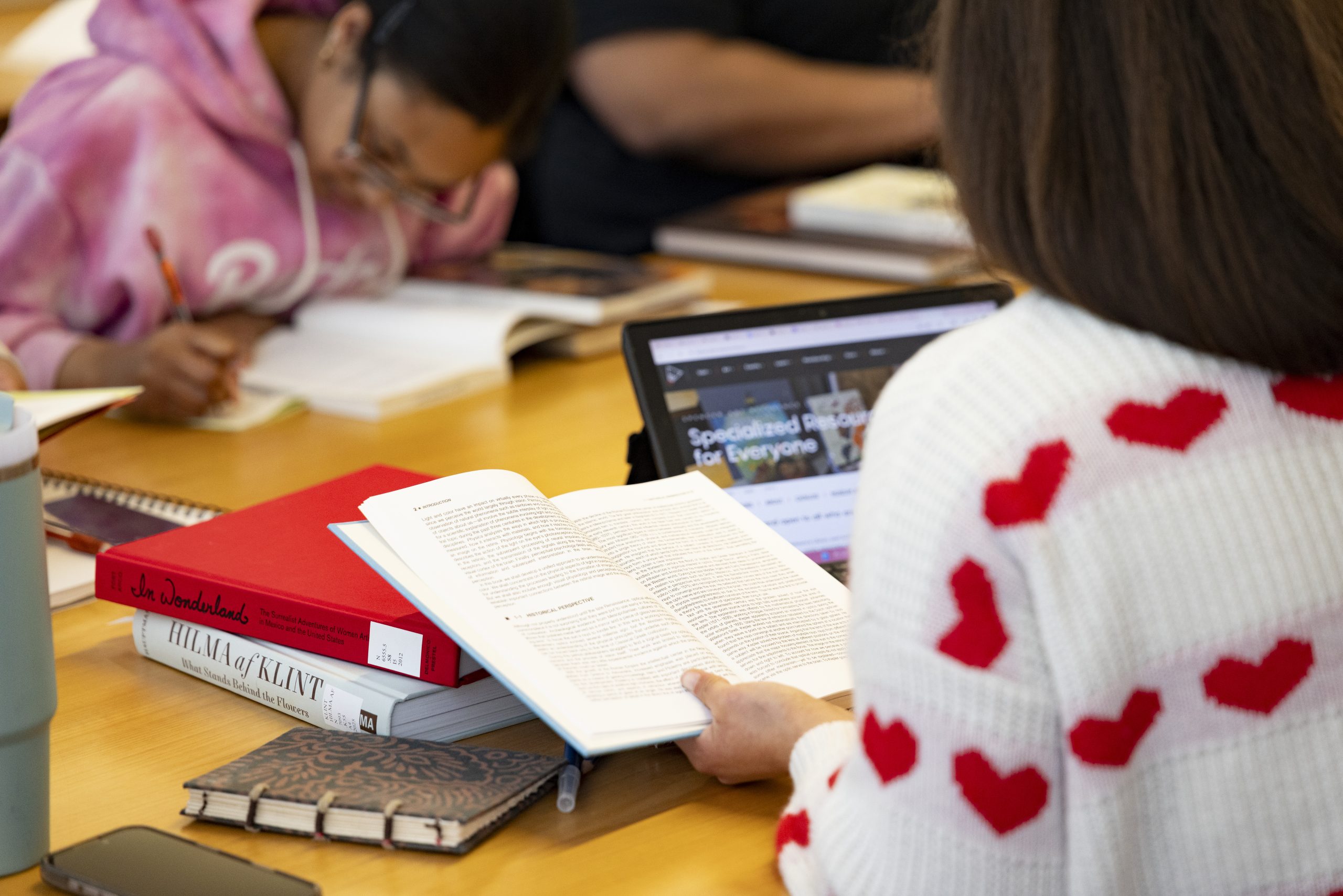 Spencer Art Reference Library, students in the Reading Room, March 2026. Digital Production & Preservation photographer, Gabe Hopkins.